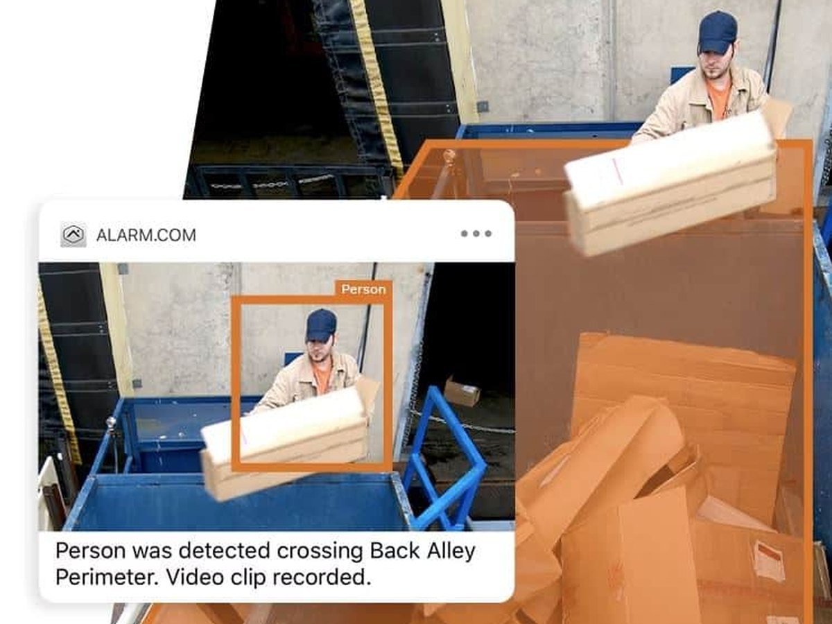 Alarm alert showing a person detected crossing a back alley perimeter