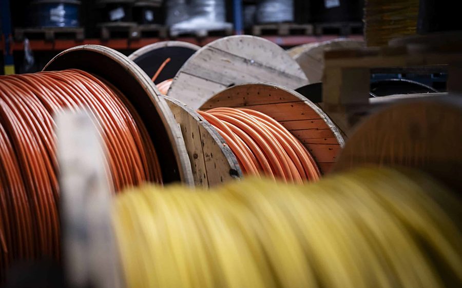 Spools of copper and yellow network cable ready for installation