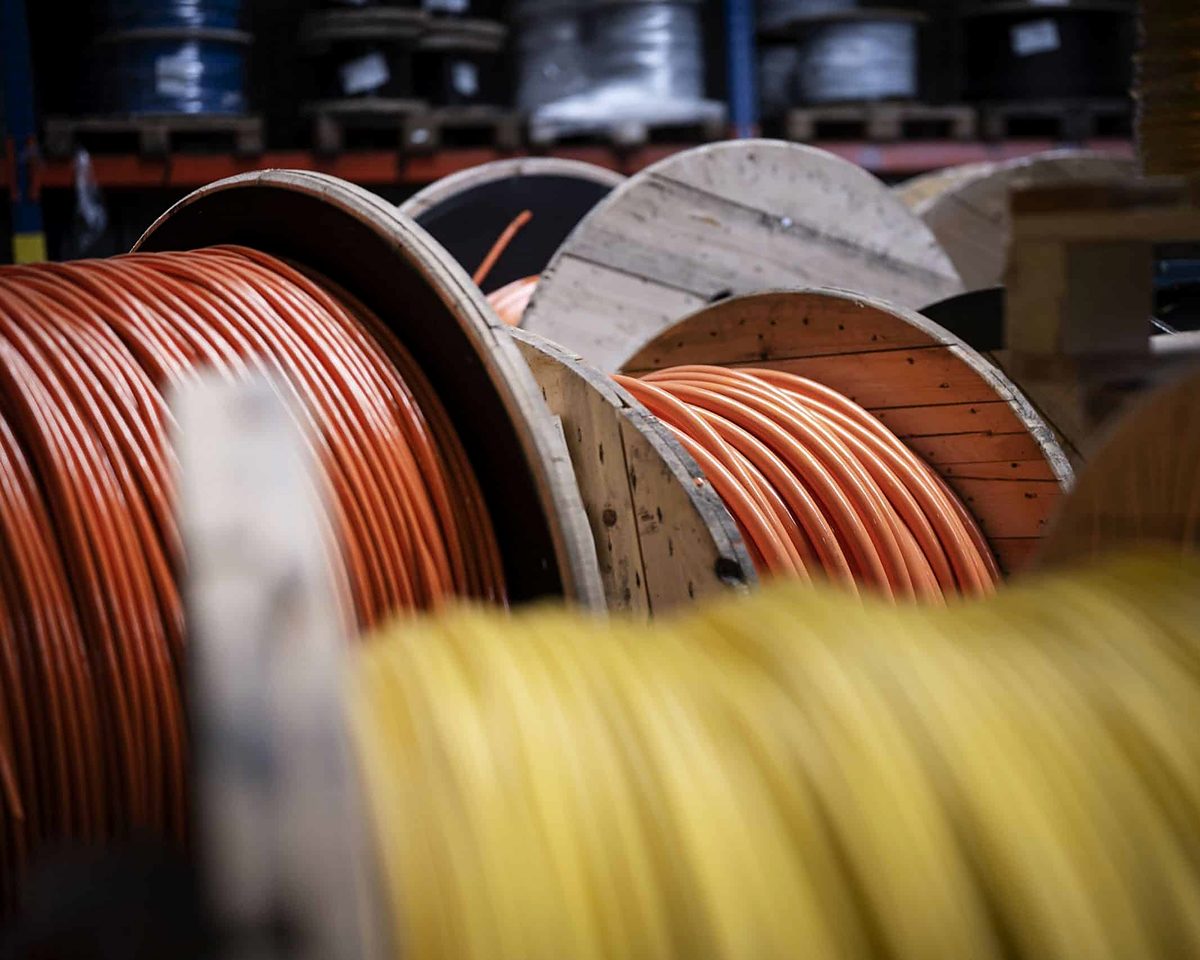 Spools of copper and yellow network cable ready for installation